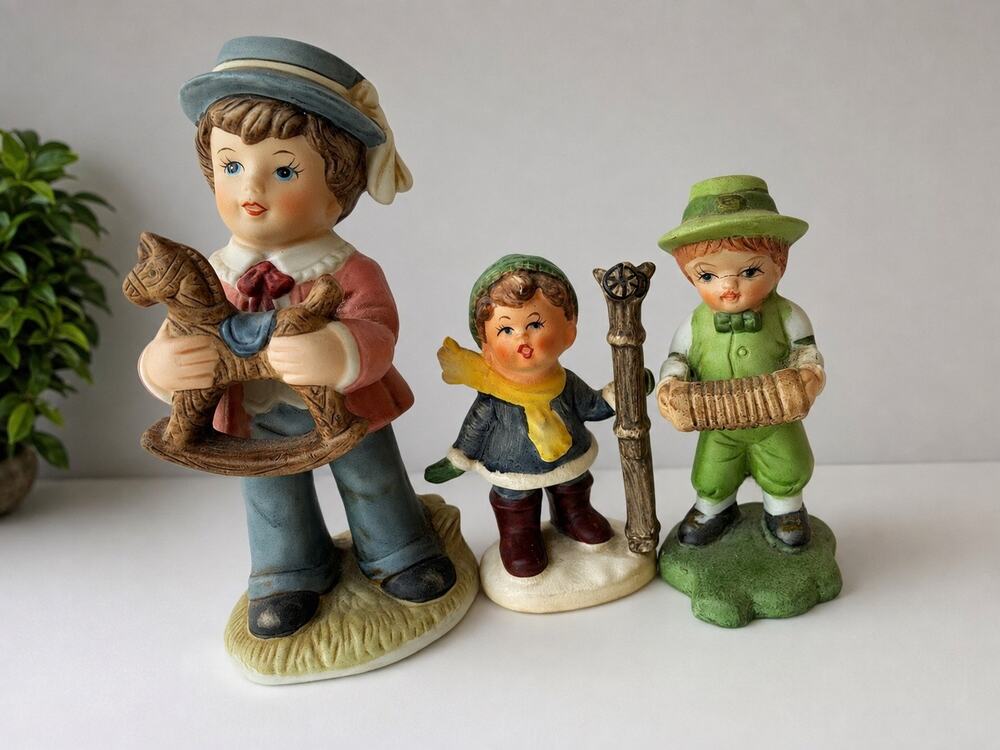 set of three vintage, hand-painted ceramic figurines styled Hummel designs